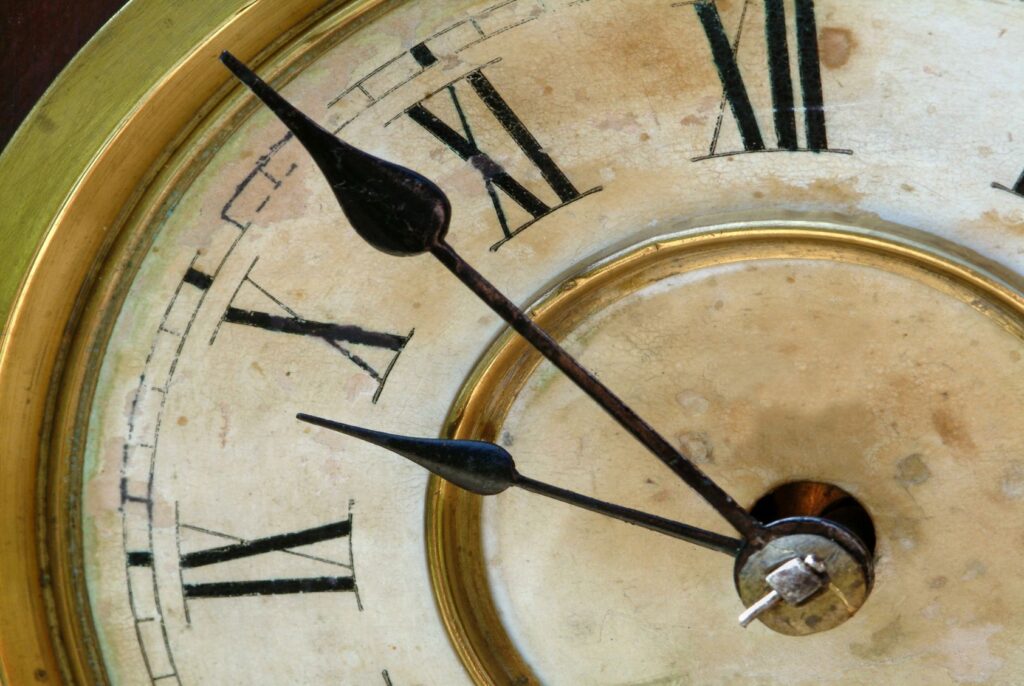 Close up of vintage clock face showing time near 10 10.