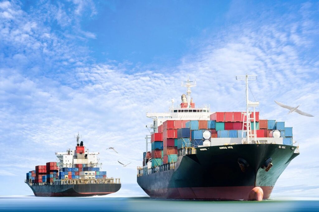 Cargo ships loaded with colorful containers.